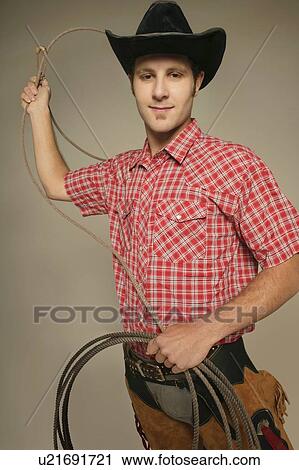 Stock Image - Man wearing western clothing. Fotosearch