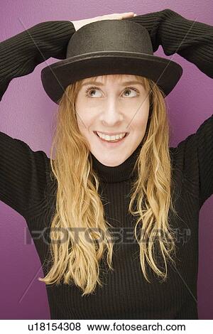 Woman wearing a hat View Large Photo Image Stock Photo - Woman wearing a hat. Fotosearch