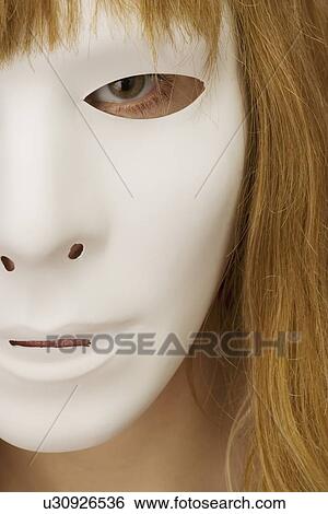 Woman wearing a mask View Large Photo Image Stock Photograph - Woman wearing a mask. Fotosearch