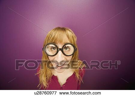 Woman wearing prop eyeglasses View Large Photo Image Stock Photo - Woman wearing prop eyeglasses. Fotosearch