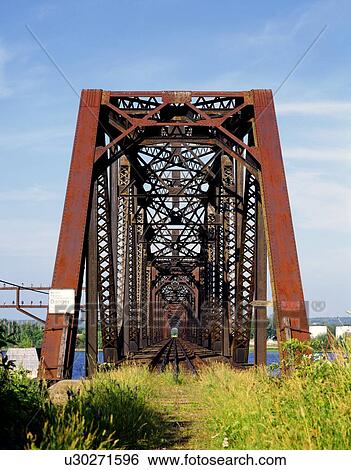Stock Photograph - Abandoned railway bridge . Fotosearch