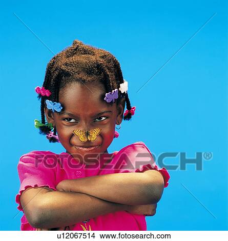 African little girl with arms crossed and a butterfly on her nose View Large Photo Image Picture - African little girl with arms crossed and a butterfly on her nose. Fotosearch