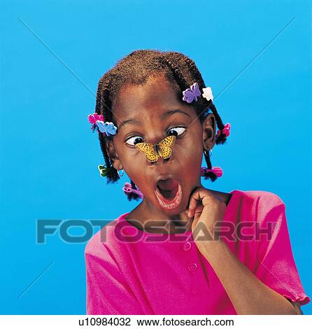 African little girl with butterfly barrettes and a butterfly on her nose looking surprised View Large Photo Image Stock Image - African little girl with butterfly barrettes and a butterfly on her nose looking surprised. Fotosearch