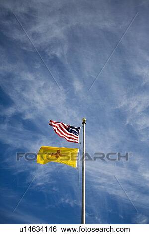 American flag and New Mexico flag on flag pole View Large Photo Image Stock Photograph - American flag and New Mexico flag on flag pole . Fotosearch