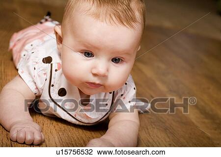 Baby on the floor View Large Photo Image Stock Image - Baby on the floor. Fotosearch