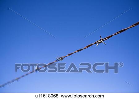 Stock Photo - Barbed wire fence. Fotosearch