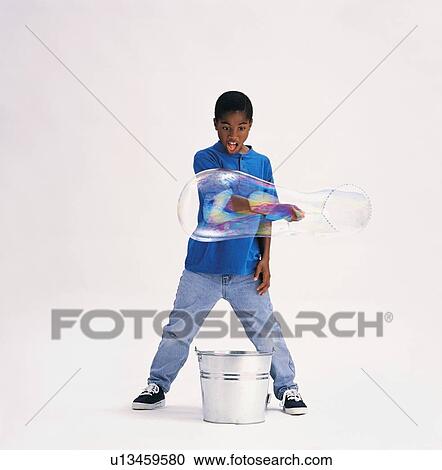 Boy making bubbles View Large Photo Image Stock Image - Boy making bubbles. Fotosearch