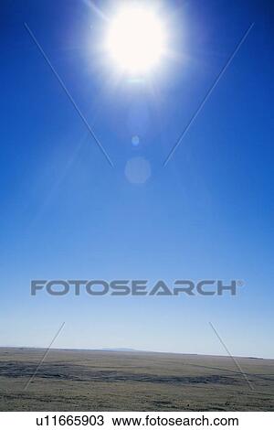 Stock Image - Bright Sun over a landscape. Fotosearch