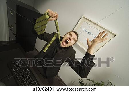 Businessman frustrated in office View Large Photo Image Stock Image - Businessman frustrated in office. Fotosearch