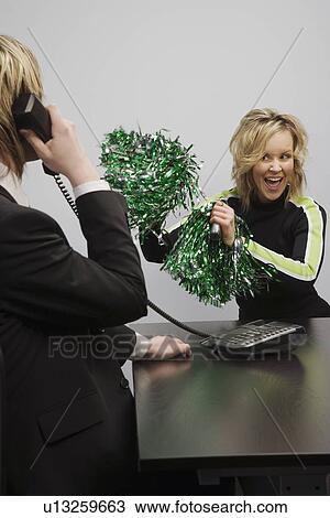 Businessman On Phone Beside Cheerleader View Large Photo Image Stock Image - Businessman On Phone Beside Cheerleader. Fotosearch