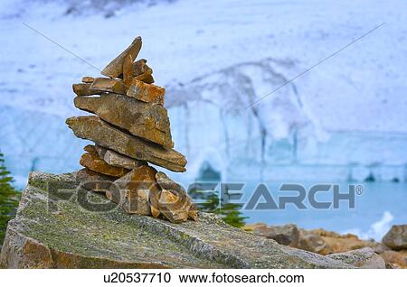 Cairn in front of glacier, ice cave and mountain View Large Photo Image Stock Image - Cairn in front of glacier, ice cave and mountain . Fotosearch