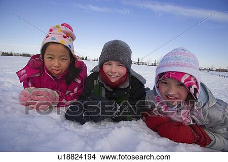 Children playing in the snow View Large Photo Image Picture - Children playing in the snow. Fotosearch