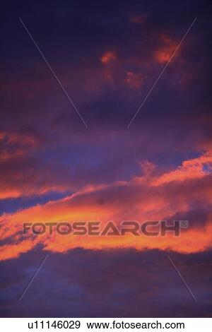 Clouds in sky with pink glow View Large Photo Image Stock Photo - Clouds in sky with pink glow. Fotosearch