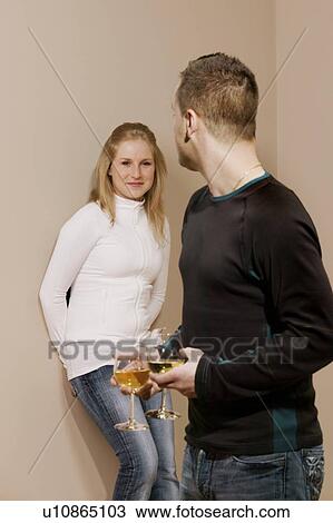 Stock Image - Couple having wine together. Fotosearch