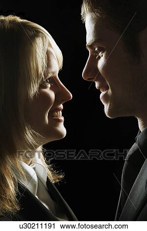 Couple looking at each other View Large Photo Image Stock Image - Couple looking at each other. Fotosearch