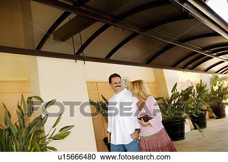 Stock Image - Couple walking together. Fotosearch