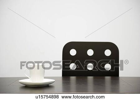 Stock Photo - Cup on a table. Fotosearch