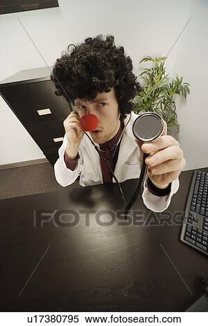 Doctor with clown nose and hair View Large Photo Image Stock Photography - Doctor with clown nose and hair. Fotosearch