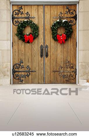 Doors with Christmas wreaths View Large Photo Image Stock Photography - Doors with Christmas wreaths. Fotosearch