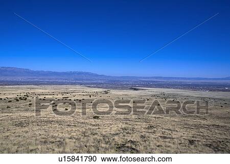 Stock Image - East view of Albuquerque, New Mexico, in the far distance. Fotosearch