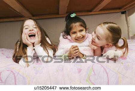 Stock Photo - Girls at a sleepover. Fotosearch