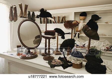 Stock Image - Historical hat and shoe shop in Fort Edmonton, Alberta. Fotosearch