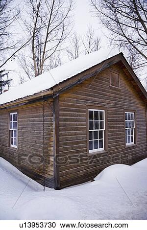 Stock Image - House in the snow. Fotosearch