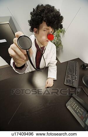 Humourous male doctor View Large Photo Image Stock Photograph - Humourous male doctor. Fotosearch