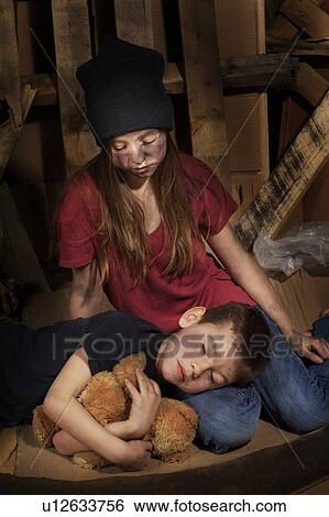 Stock Photograph - Impoverished boy and girl. Fotosearch