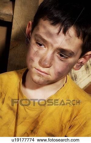 Picture - Impoverished boy. Fotosearch