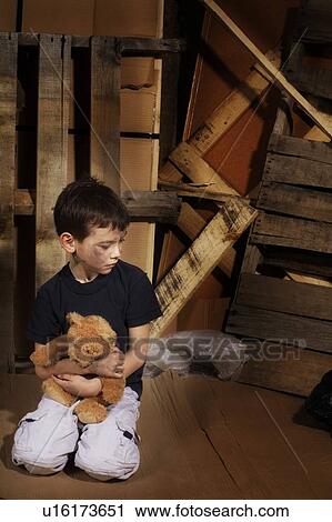 Stock Image - Impoverished boy. Fotosearch