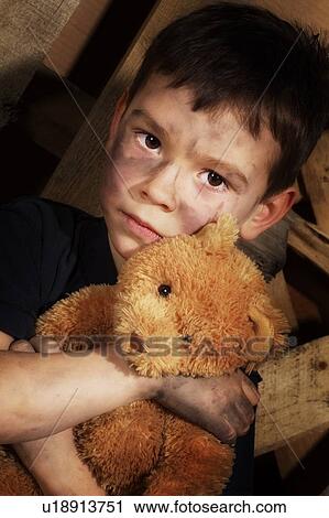 Stock Image - Impoverished boy. Fotosearch