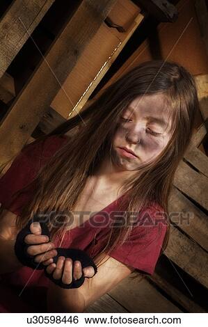 Stock Photograph - Impoverished girl. Fotosearch