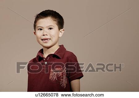 Little boy smiling and posed wearing red shirt View Large Photo Image Stock Photo - Little boy smiling and posed wearing red shirt. Fotosearch