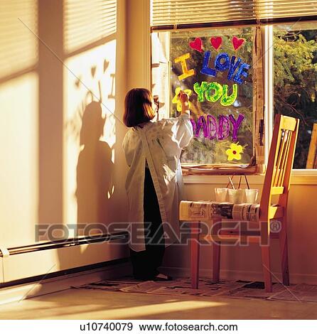 Little girl painting 'i love you daddy' on window View Large Photo Image Stock Photo - Little girl painting 'i love you daddy' on window. Fotosearch