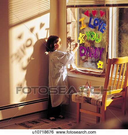 Little girl painting 'I love you daddy' on window View Large Photo Image Stock Photograph - Little girl painting 'I love you daddy' on window. Fotosearch