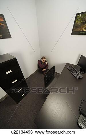 Man hiding in office corner View Large Photo Image Stock Image - Man hiding in office corner. Fotosearch