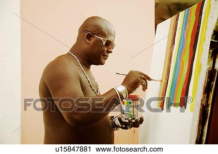 Stock Image - Man painting. Fotosearch