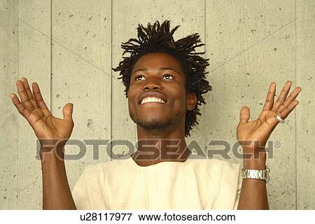 Stock Photo - Man worshipping. Fotosearch