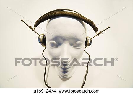 Picture - Mannequin head with headphones. Fotosearch