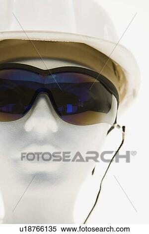 Mannequin wearing safety glasses and a helmet View Large Photo Image Stock Photography - Mannequin wearing safety glasses and a helmet. Fotosearch