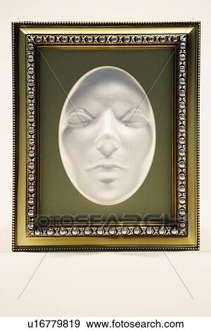 Mask in a picture frame View Large Photo Image Stock Photo - Mask in a picture frame. Fotosearch