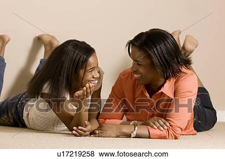 Stock Photo - Mom and daughter relaxing together. Fotosearch