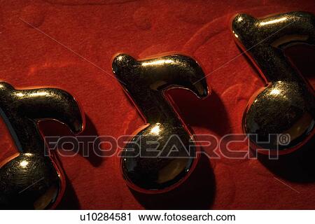 Stock Image - Musical notes on the red background. Fotosearch