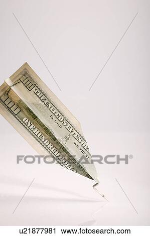 One hundred American dollar bill folded into paper airplane View Large Photo Image Stock Image - One hundred American dollar bill folded into paper airplane. Fotosearch