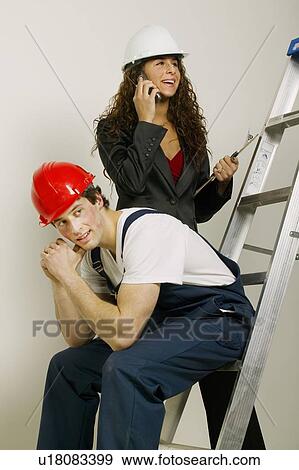 People with construction hats at work View Large Photo Image Stock Photo - People with construction hats at work. Fotosearch