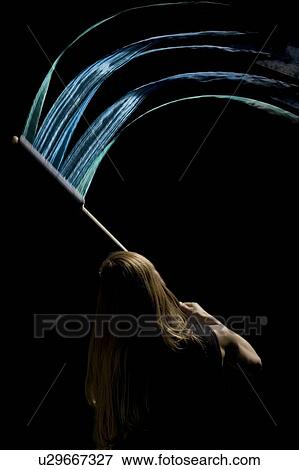 Person waving flag in black background View Large Photo Image Stock Photo - Person waving flag in black background. Fotosearch