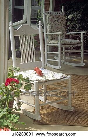 Stock Image - Rocking chairs on country porch . Fotosearch