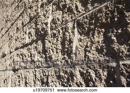 Stock Image - Rough cement wall . Fotosearch