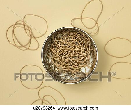 Picture - Rubber bands in metal tin . Fotosearch